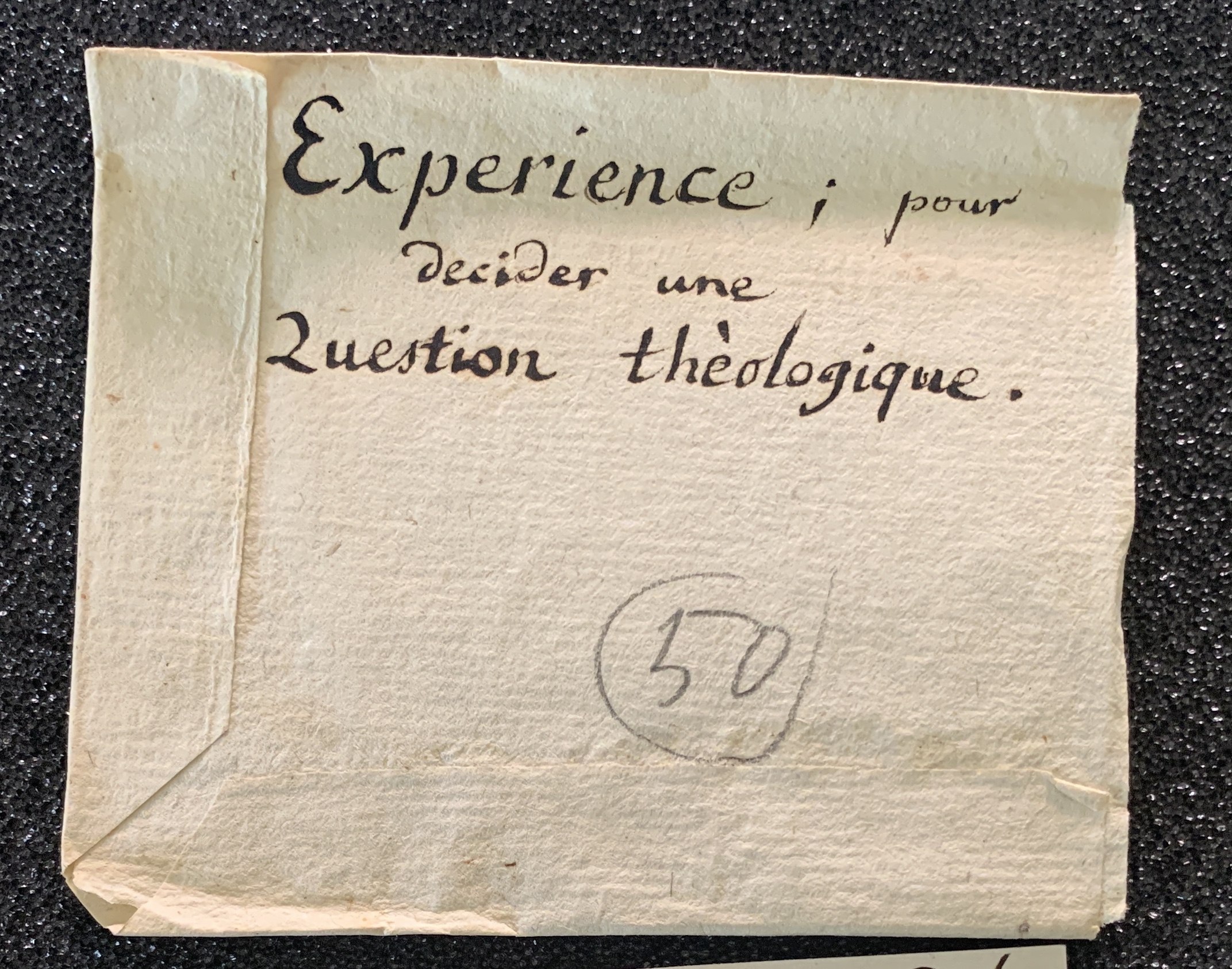 Figure 1 - Sachet titré « Expérience ; pour
            décider une question théologique ». Fonds Le Sage, BGE.
