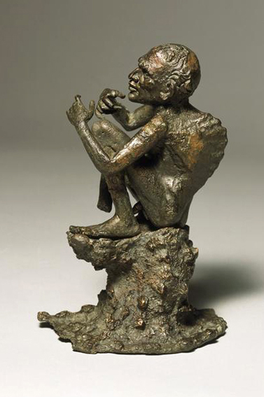 Figure 11 - Mendiant bossu assis sur un
              rocher